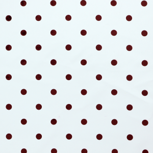 White and brown fabric featuring a classic polka dot pattern with evenly spaced dark dots set against a clean white background.