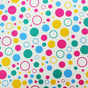 A fun and colourful fabric pattern featuring random solid and hollow polka dots in pink, teal, yellow, and blue on a white background.