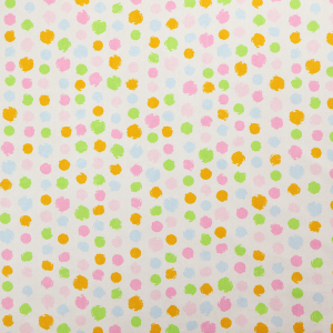 A whimsical fabric pattern featuring scattered painterly dots in soft shades of pink, yellow, lime green, and light blue on a white background.